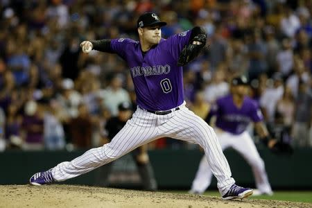 FILE PHOTO: Aug 10, 2018; Denver, CO, USA; Colorado Rockies relief pitcher Adam Ottavino (0) pitches in the ninth inning against the Los Angeles Dodgers at Coors Field. Mandatory Credit: Isaiah J. Downing-USA TODAY Sports - 11064672