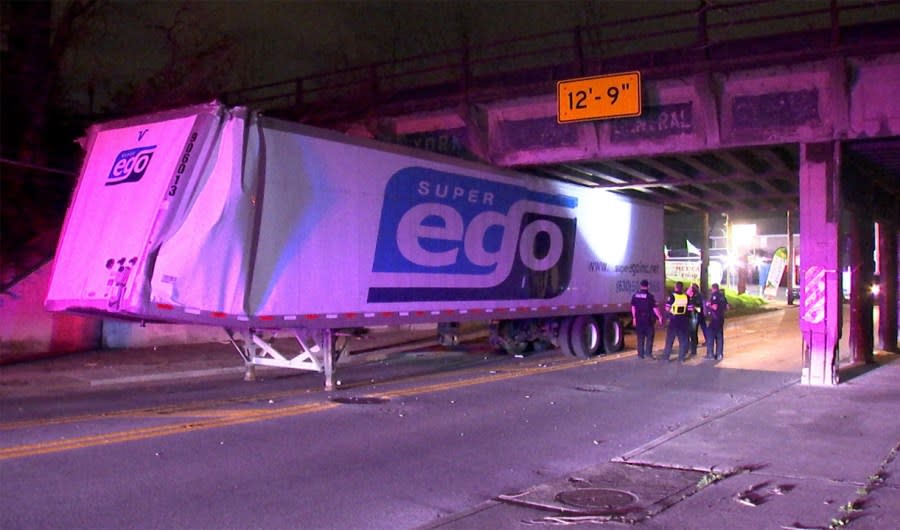 An out of state semi-truck got stuck under the bridge overpass at East 17th Avenue near the Ohio Expo Center, April 16, 2024. (NBC4/Ronald Clark)