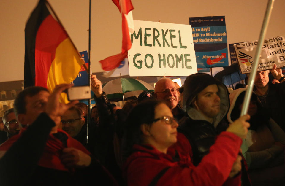 Supporters of the AfD political party protest against German Chancellor Angela Merkel's liberal policy towards taking in migrants and refugees on October 14, 2015 in Magdeburg, Germany. Photo: Sean Gallup/Getty Images