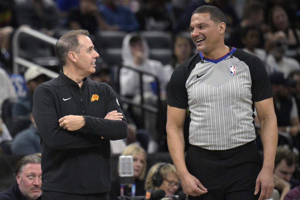 Phoenix Suns head coach Frank Vogel, left, talks with official Nate Green, right, during the first half of an NBA basketball game against the Orlando Magic, Sunday, Jan. 28, 2024, in Orlando, Fla. (AP Photo/Phelan M. Ebenhack)