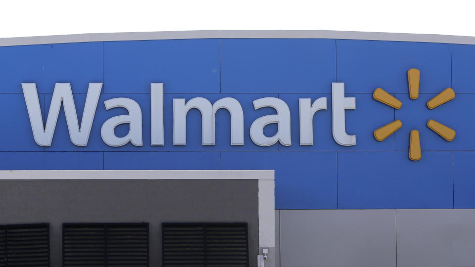 FILE - In this Sept. 3, 2019 file photo, a Walmart logo is displayed outside of a Walmart store, in Walpole, Mass. Across the country, drug and alcohol recovery programs claiming to help the poor and the desperate are instead conscripting them into forms of indentured servitude, requiring them to work without pay or for pennies on the dollar, in exchange for their stay. For the first time, Reveal from The Center for Investigative Reporting has determined how widespread these programs have become. Some work at rehab-run businesses, such as thrift stores or car washes. Others work at outside enterprises, including small businesses, temp agencies and some of the largest, most profitable corporations in the country. Rehab participants have worked at Williams Sonoma, Shell, Walmart and Tyson Foods. (AP Photo/Steven Senne, File)
