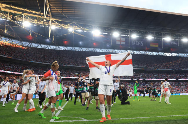 LONDON, ENGLAND - JULY 31: Millie Bright of England holds an England flag during the UEFA Women's Euro 2022 final match between England and Germany at Wembley Stadium on July 31, 2022 in London, England. (Photo by Alex Pantling - The FA/The FA via Getty Images)