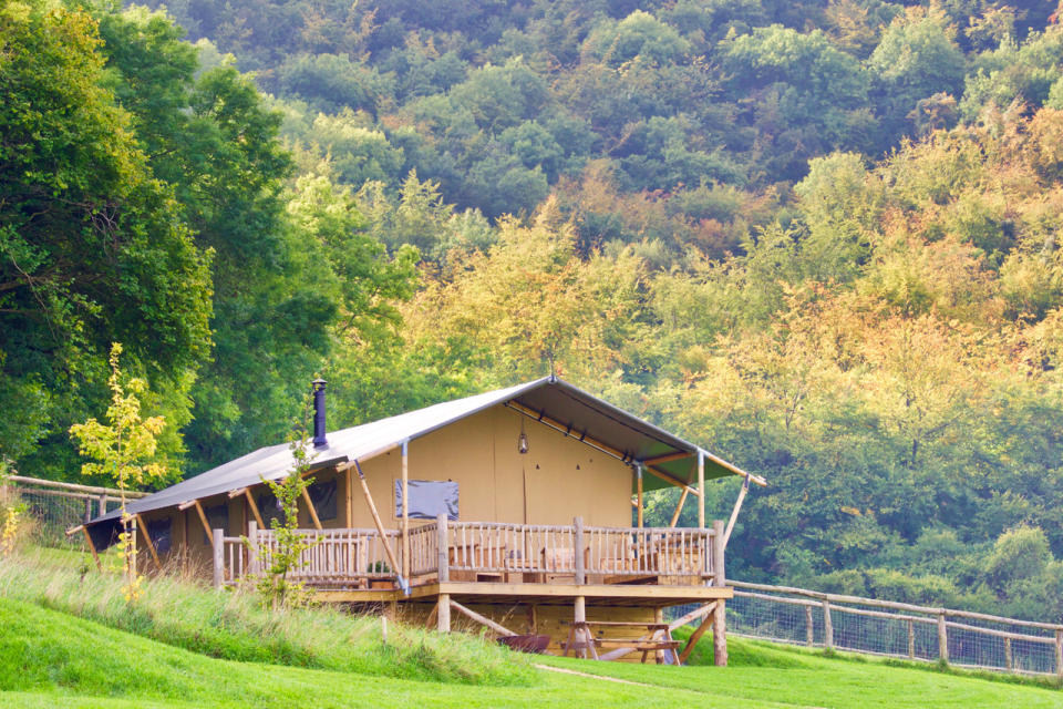 Tucked away in the Dorset countryside, Loose Reins offers a variety of family-friendly glamping options, including <a href="https://www.loosereins.co.uk/lodges/children" rel="nofollow noopener" target="_blank" data-ylk="slk:three lodges;elm:context_link;itc:0;sec:content-canvas" class="link ">three lodges</a> that each sleep six people. They are fully kitted out with sofas, wood-burning stoves and proper bathrooms with flushing loos. For children, there’s space for a travel cot and underneath the cabin bed there’s a play area, plus pens, paper, beanbags and toys. Two nights is from £73.75pp, based on four sharing. <em>[Photo: Loose Reins]</em>