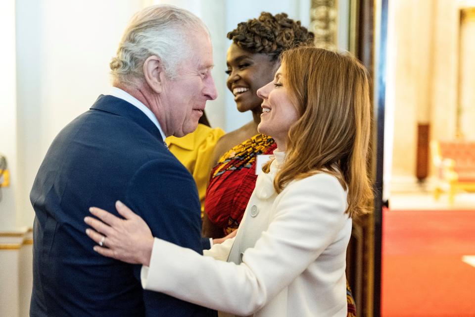 Britain's King Charles III (L) meets with British singer Geri Halliwell Horner (R) during a ceremony for the Trust Award 2023 winners and celebrity ambassadors at Buckingham Palace, in London, on May 17, 2023. (Photo by Geoff Pugh / POOL / AFP) (Photo by GEOFF PUGH/POOL/AFP via Getty Images)