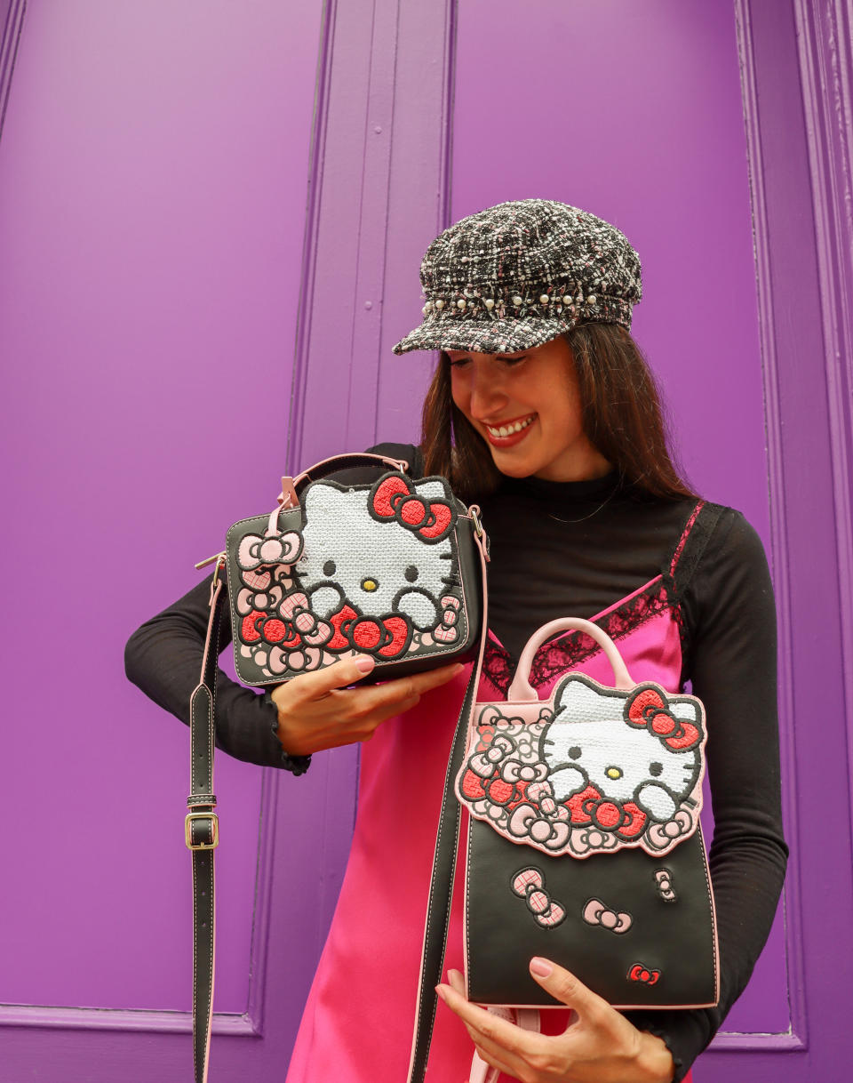 Danielle DiFerdinando clutches the Hello Kitty bags.