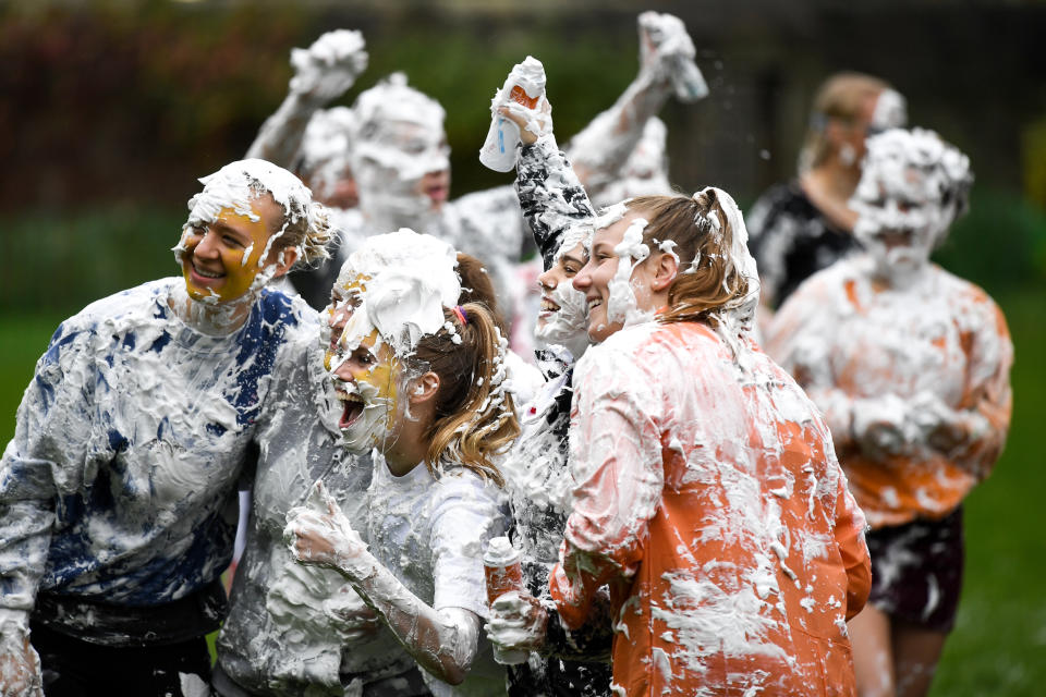 <p>Students from St Andrews University indulge in a tradition of covering themselves with foam to honor the “academic family” on Lower College Lawn on Oct. 23, 2017, in St Andrews, Scotland. (Photo: Jeff J Mitchell/Getty Images) </p>