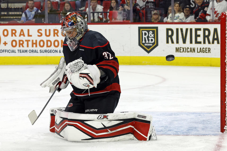 Carolina Hurricanes goaltender Antti Raanta looks back at the puck during the first period of the team's NHL hockey game against the Arizona Coyotes Saturday, Jan. 27, 2024, in Raleigh, N.C. (AP Photo/Karl B DeBlaker)