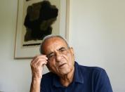 Indian Partition survivor Raj Khanna, 84, poses for a photograph at his son's house in Mumbai