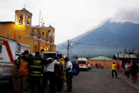 <p>Firefighters pray after Fuego volcano erupted violently in San Juan Alotenango, Guatemala June 3, 2018. (Photo: Luis Echeverria/Reuters) </p>