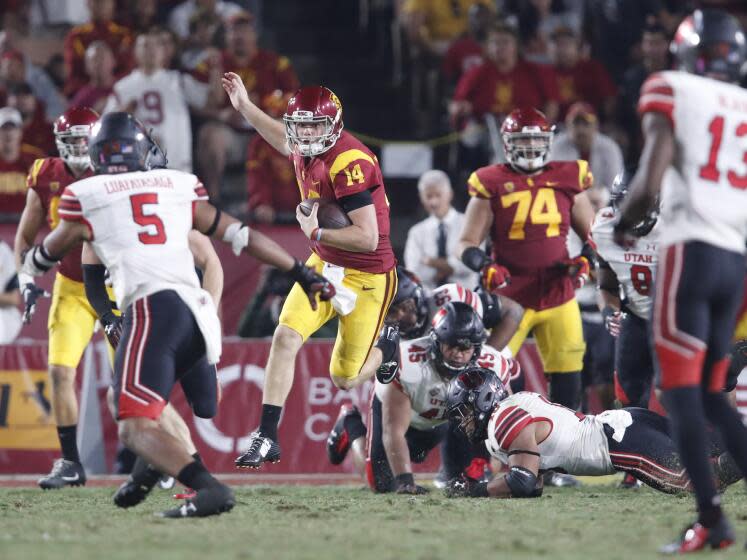 LOS ANGELES, CALIF. -- SATURDAY, OCT. 14, 2017: USC quarterback Sam Darnold leaps.