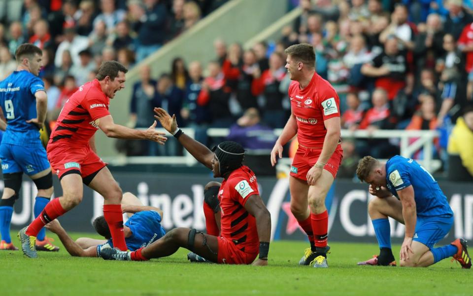 Alex Goode, Maro Itoje and Owen Farrell of Saracens celebrate winning the Champions Cup Final match between Saracens and Leinster at St. James Park on May 11, 2019 in Newcastle  - GETTY IMAGES