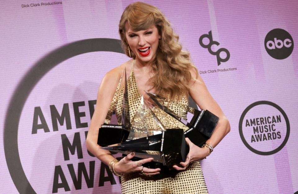 Taylor Swift poses with the Artist of the Year, Favourite Music Video, Favourite Female Pop Artist, Favourite Pop Album, Favourite Female Country Artist, Favourite Country Album award at last night’s ceremony (REUTERS)