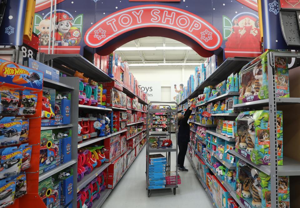 Stacking one of the many toy aisles in preparation for Black Friday at the Walmart in Secaucus. 