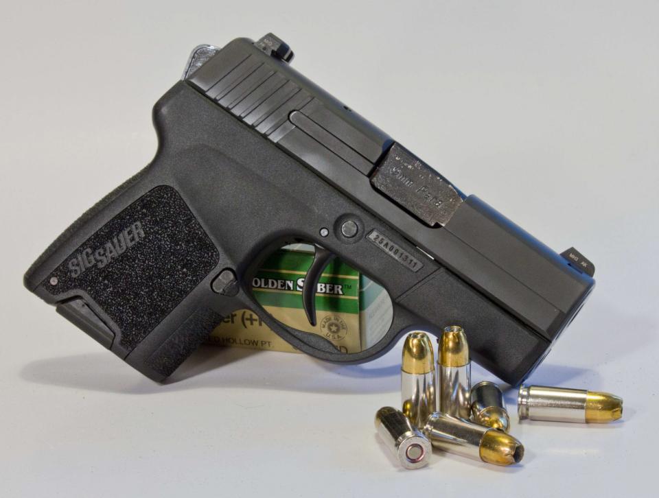 A Sig Sauer P290 pistol with ammo 