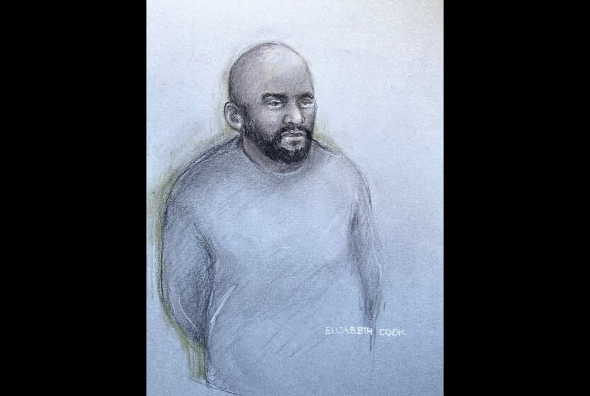 This court artist sketch by Elizabeth Cook shows Aine Leslie Davis, 38, appearing in the dock at Westminster Magistrates' Court, central London, Thursday, Aug. 11, 2022. An alleged member of an Islamic State hostage-taking cell nicknamed "The Beatles" has been charged with terrorism offenses in Britain on Thursday after being deported from Turkey. London police say Aine Davis was arrested at Luton Airport north of London on Wednesday night and charged with offenses under the Terrorism Act. (Elizabeth Cook/PA via AP)