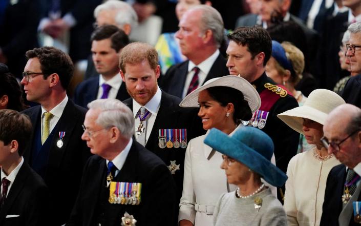 The Duke and the Duchess of Sussex sat away from the Cambridges at the thanksgiving service at St Paul's Cathedral - Victoria Jones/Reuters
