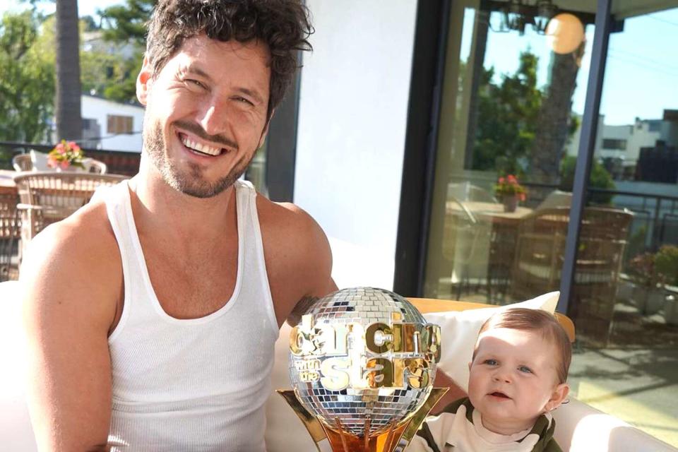 <p>Jenna Johnson</p> Val Chmerkovskiy with Rome after winning 