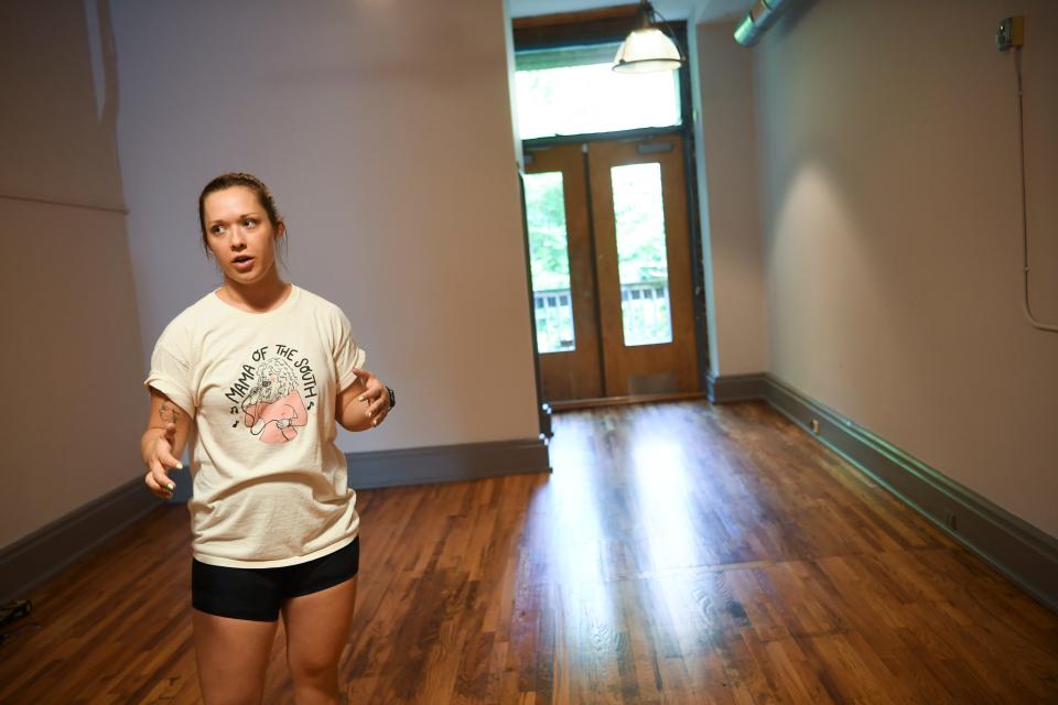 Knoxville native artist Paris Woodhull stands in her new studio space on the 100 block of Gay Street in downtown Knoxville, Tuesday, Aug. 2, 2022. Woodhull hopes to open the space by the beginning of September. 