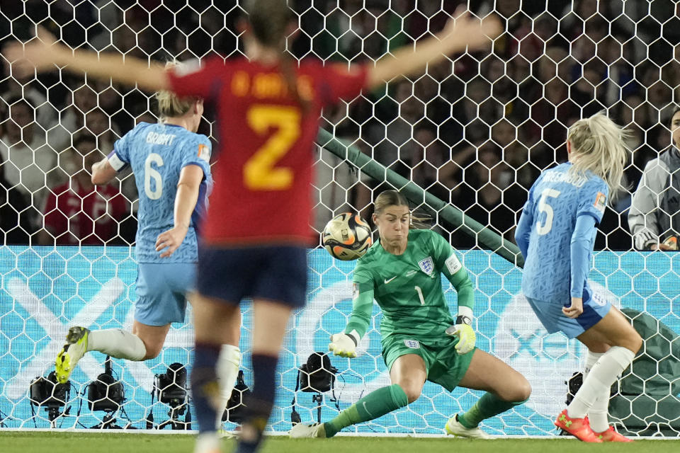 England's goalkeeper Mary Earps, centre, makes a save during the final of Women's World Cup soccer between Spain and England at Stadium Australia in Sydney, Australia, Sunday, Aug. 20, 2023. (AP Photo/Rick Rycroft)