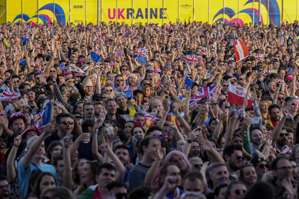 Eurovision fans watch the Eurovision Song Contest final on a giant screen in the Eurovision Village on May 13, 2023, in Liverpool, England. The UK is hosting on behalf of Ukraine, whose entry won last year's song contest, but could not host this year's contest due to the war. 