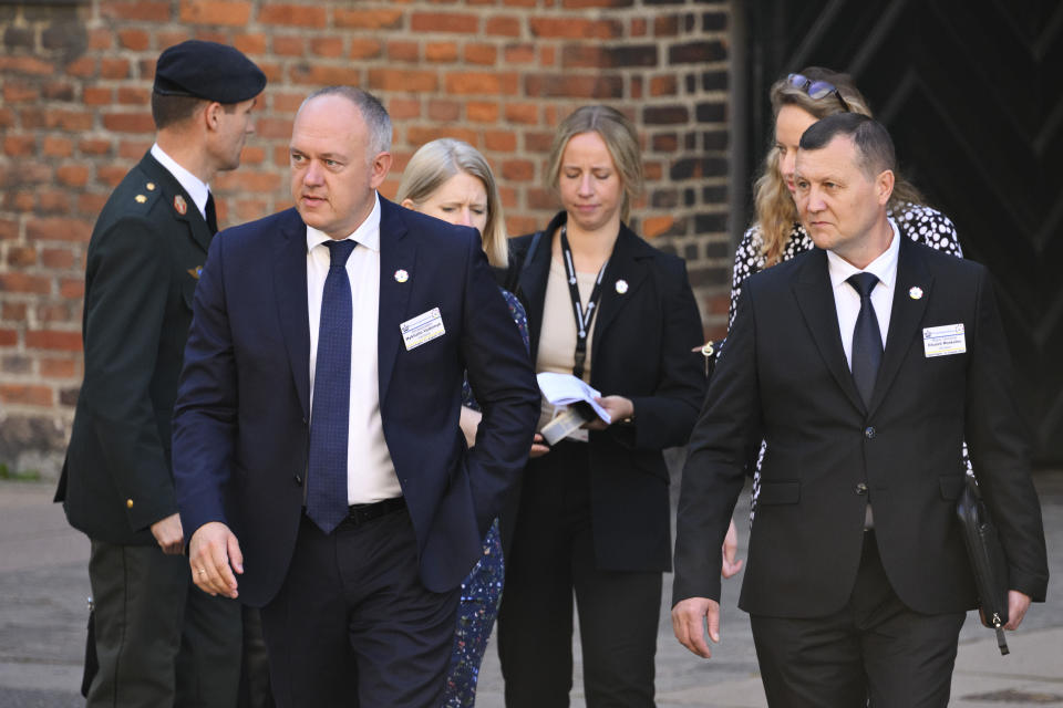 Ukraine's ambassador to Denmark Mykhailo Vydoinyk, left, arrives at the donor conference for Ukraine at Christiansborg, in Copenhagen, Thursday, Aug. 11, 2022. The international donation conference will strengthen the long-term support for Ukraine with discussions on how financing, weapons production, training and demining can be strengthened going forward. (Philip Davali/Ritzau Scanpix via AP)