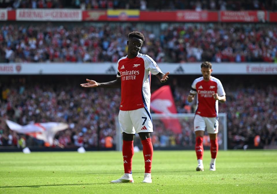 LONDON, ENGLAND: Bukayo Saka of Arsenal celebrates scoring his team's second goal during the Premier League match between Arsenal FC and Wolverhampton Wanderers FC at Emirates Stadium on August 17, 2024. (Photo by Shaun Botterill/Getty Images)