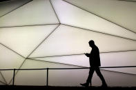 <p>A man looks at his phone as he walks along the Samsung stand during the Mobile World Congress wireless show in Barcelona, Spain, Feb. 27, 2017. The Japanese tech maker is unveiling a new flagship smartphone at Mobile World Congress, one that boasts a super-slow-motion camera and 4K screen. Mobile World Congress, the world’s leading mobile industry event, runs Feb. 27 to March 1 in Barcelona. (AP Photo/Emilio Morenatti) </p>