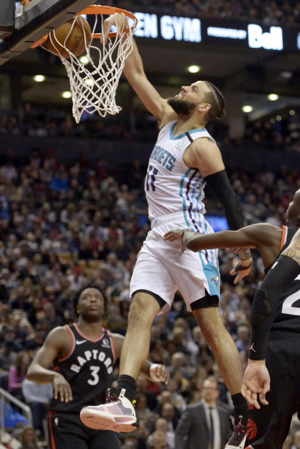 Charlotte Hornets forward Cody Martin (11) dunks during second-half NBA basketball game action against the Toronto Raptors in Toronto, Friday, Feb. 28, 2020. (Nathan Denette/The Canadian Press via AP)