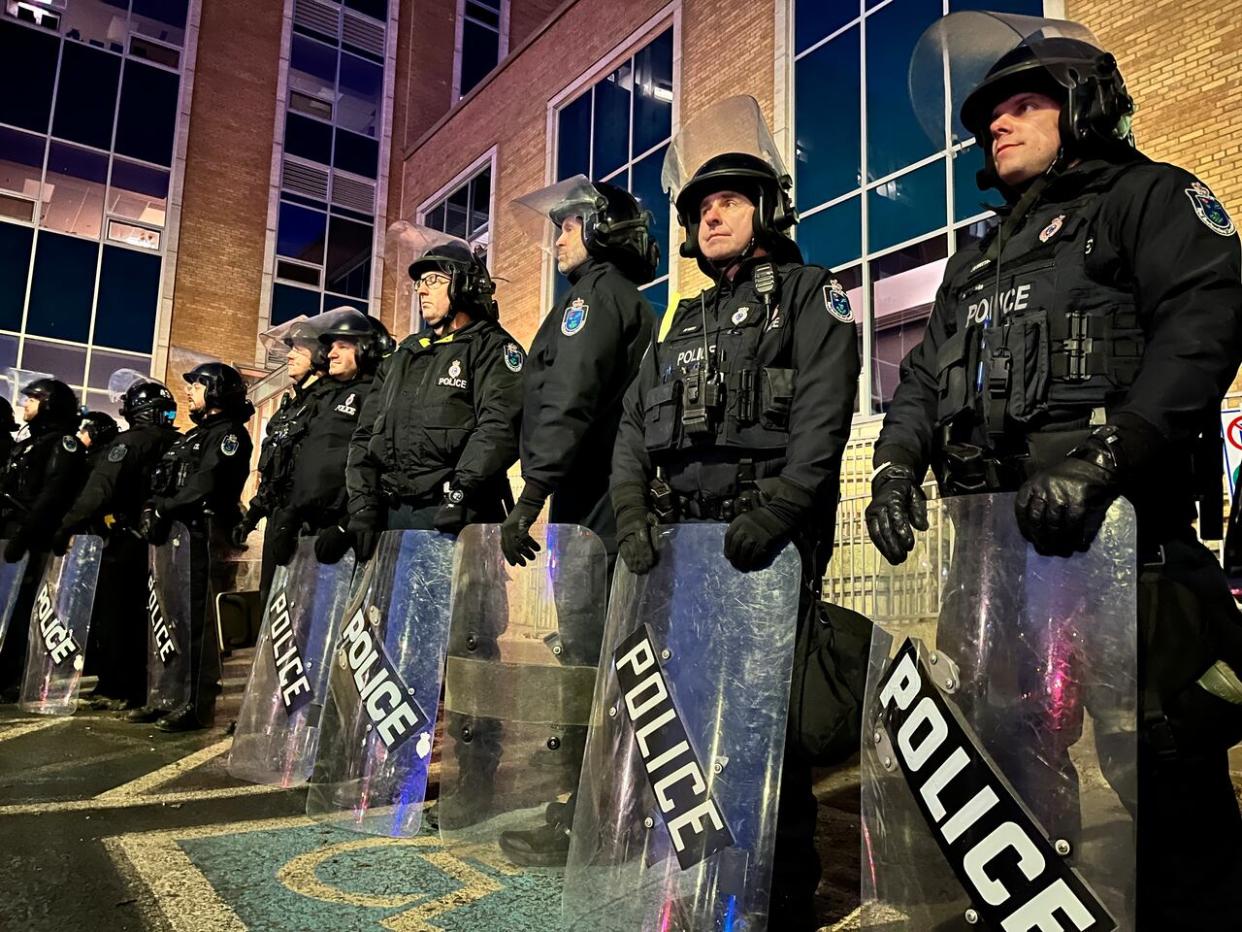 Police in riot gear were stationed outside Confederation Building in St. John's on Thursday morning, hoping to maintain order amid protests by fish harvesters and supporters. (Terry Roberts/CBC - image credit)