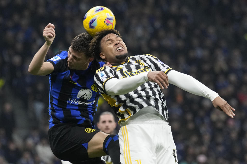 Inter Milan's Benjamin Pavard, left, and Juventus' Weston McKennie jump for the ball during a Serie A soccer match between Inter Milan and Juventus, in Milan, Italy, Sunday, Feb. 4, 2024. (AP Photo/Antonio Calanni)