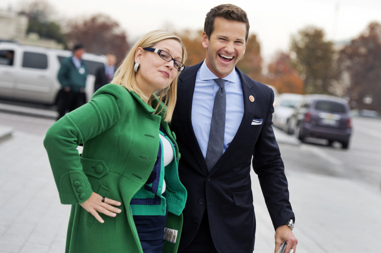 Reps. Kyrsten Sinema, D-Ariz., and Aaron Schock, R-Ill., say goodbye after at the bottom of the House Steps after the last vote of the week in the Capitol, December 4, 2014. (Tom Williams/CQ Roll Call via Getty Images)