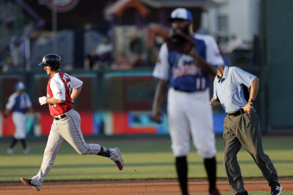 Liberty Division's Mike Ohlman, left, of the Somerset Patriots, runs the bases after hitting a two-run home run off Freedom Division's Daryl Thompson, right, of the Southern Maryland Blue Crabs, during the second inning of the Atlantic League All-Star minor league baseball game, Wednesday, July 10, 2019, in York, Pa. (AP Photo/Julio Cortez)