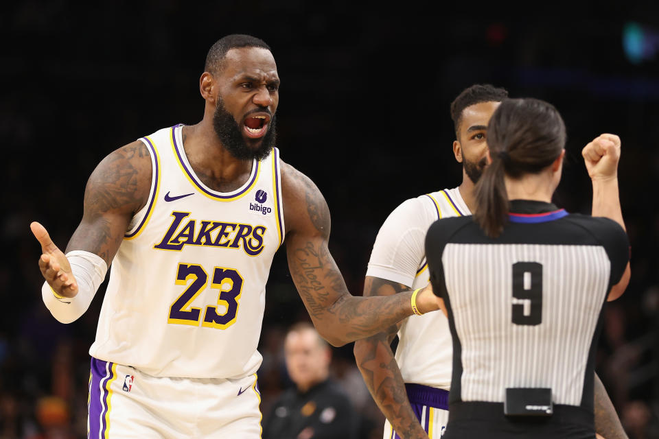 PHOENIX, ARIZONA - FEBRUARY 25: LeBron James #23 of the Los Angeles Lakers reacts to referee Natalie Sago #9 after a foul call during the second half of the NBA game against the Phoenix Suns at Footprint Center on February 25, 2024 in Phoenix, Arizona. The Suns defeated the Lakers 123-113. NOTE TO USER: User expressly acknowledges and agrees that, by downloading and or using this photograph, User is consenting to the terms and conditions of the Getty Images License Agreement.  (Photo by Christian Petersen/Getty Images)