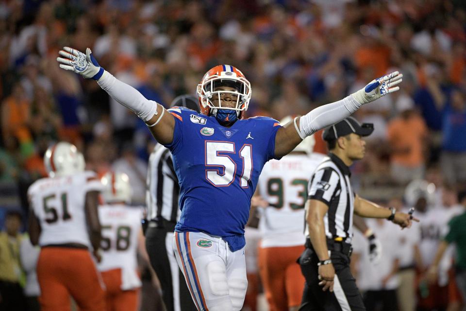 Florida linebacker Ventrell Miller (51) celebrates after a missed field goal by Miami during the second half of an NCAA college football game Saturday, Aug. 24, 2019, in Orlando, Fla. (AP Photo/Phelan M. Ebenhack)