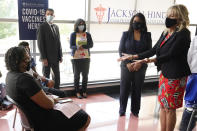 First lady Jill Biden, right, and Jackson-Hinds Comprehensive Health Center CEO Jasmin Chapman speak to recently vaccinated patients during a visit to a COVID-19 vaccination site at Jackson State University in Jackson, Miss., Tuesday, June 22, 2021, as part of Biden administration's nationwide tour to reach Americans who haven't been vaccinated and to promote vaccine education. (AP Photo/Rogelio V. Solis)