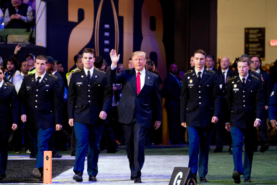 <p>President Donald Trump waves before the NCAA college football playoff championship game between Georgia and Alabama Monday, Jan. 8, 2018, in Atlanta. (AP Photo/Andrew Harnik) </p>