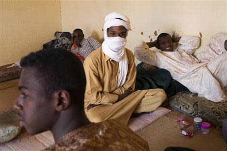 Toubou migrant smugglers relax in a living room in Agadez March 13, 2014. Picture taken March 13, 2014. REUTERS/Joe Penney