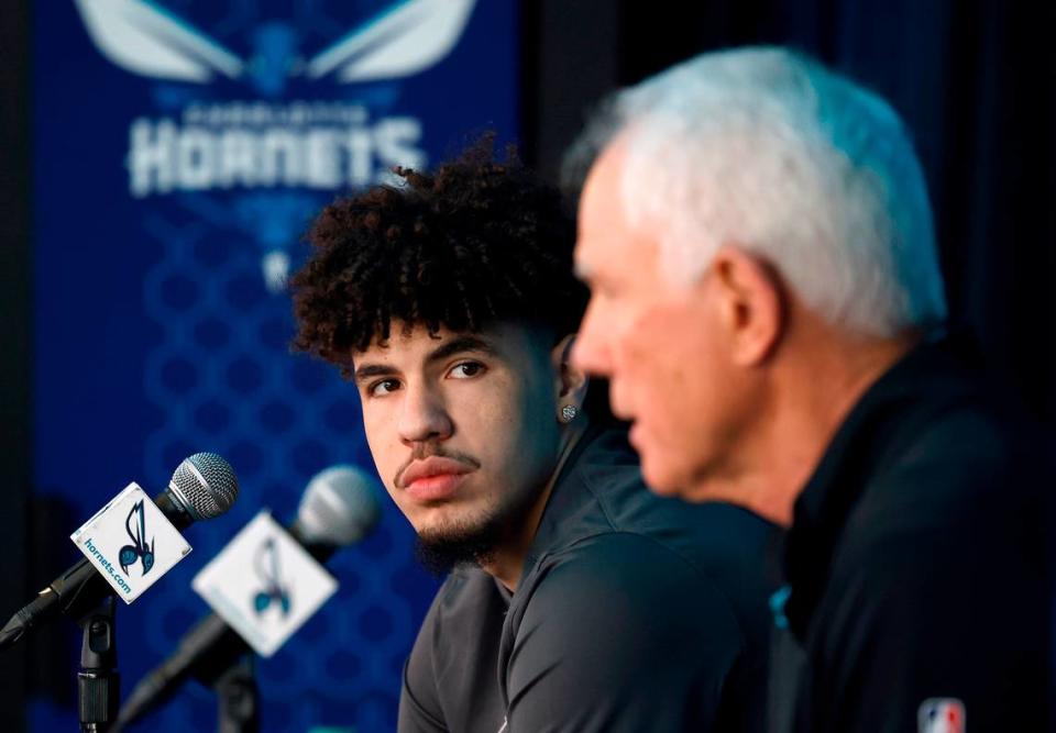 Charlotte Hornets guard LaMelo Ball, left, listens as general manager Mitch Kupchak, right, responds to a question during a press conference discussing Ball’s five-year $260 million extension with the team on Wednesday, July 19, 2023 at Spectrum Center in Charlotte, NC.