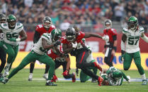 Atlanta Falcons running back Cordarrelle Patterson (84), center, runs with the ball during the first half of an NFL football game between the New York Jets and the Atlanta Falcons at the Tottenham Hotspur stadium in London, England, Sunday, Oct. 10, 2021. (AP Photo/Ian Walton)