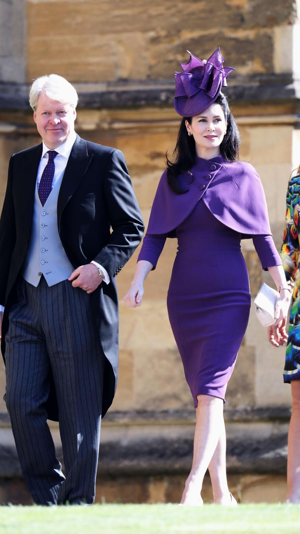<p> Karen Spencer - who married Princess Diana's brother, Charles in 2011 - wore a favourite colour of the royals for Harry and Meghan's wedding. Looking regal, Karen sported a custom Pamella Roland royal purple capelet and a form-fitting knee-length dress. </p> <p> She finished her outfit with an elaborate fascinator in the same shade, which perfectly complimented her raven black hair. </p>