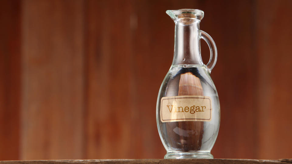 A glass bottle of distilled white vinegar