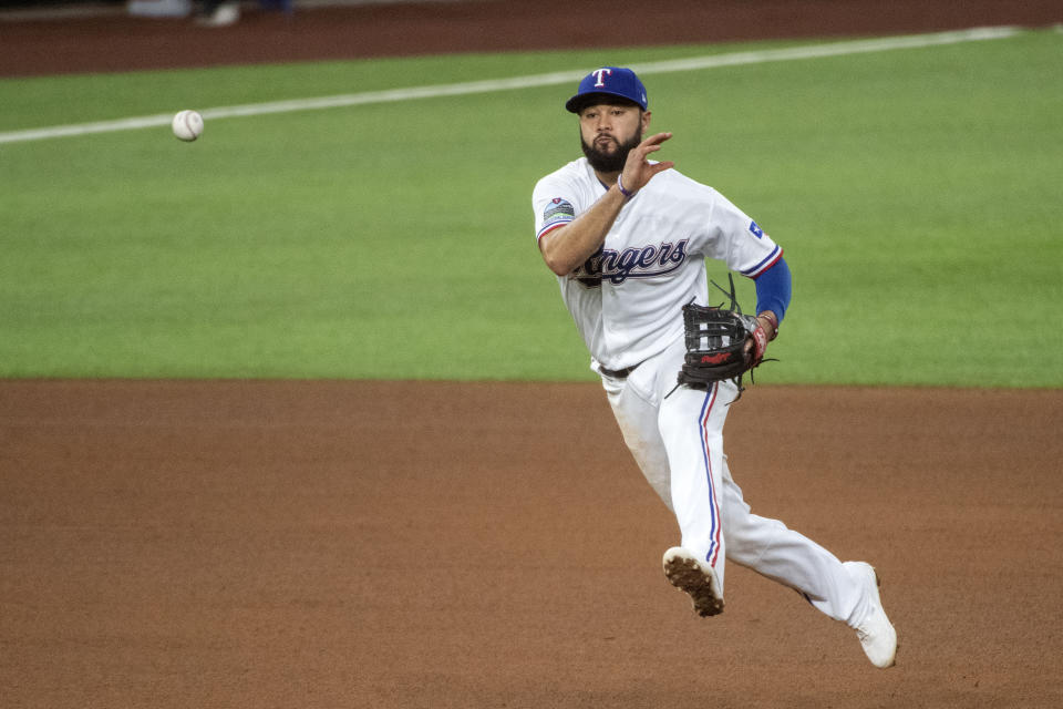 Texas Rangers third baseman Isiah Kiner-Falefa throws to first on a groundout by Arizona Diamondbacks' David Peralta during the fourth inning of a baseball game Wednesday, July 29, 2020, in Arlington, Texas. (AP Photo/Jeffrey McWhorter)