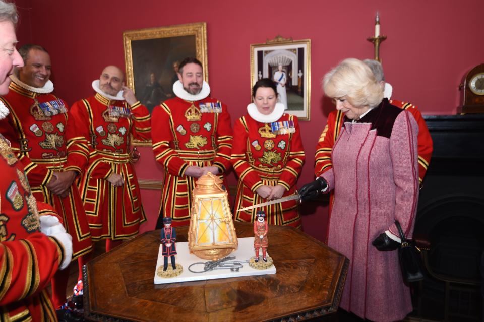 Britain's Prince Charles, Prince of Wales and Britain's Camilla, Duchess of Cornwall gesture during their visit to The Tower of London, central London on February 13, 2020, to mark 535 years since the creation of the  (Beefeaters) and to celebrate 50 years of the British Tourist Authority. (Photo by Eddie MULHOLLAND / POOL / AFP) (Photo by EDDIE MULHOLLAND/POOL/AFP via Getty Images)