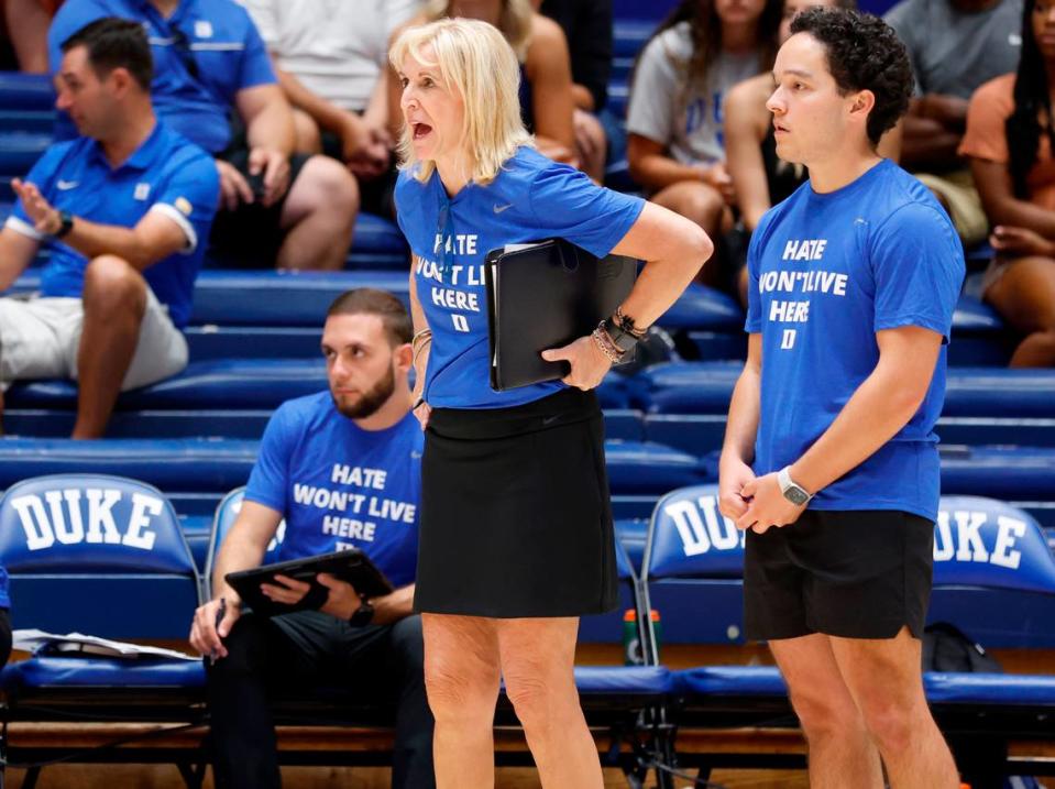 Duke volleyball head coach Jolene Nagel, center, yells instructions to her team during the Blue Devils’ game against East Tennessee State University in the Duke Invitational at Cameron Indoor Stadium in Durham, N.C., Friday, Sept. 2, 2022. Assistant coach Jeremy Garcia stands at right. Ethan Hyman/ehyman@newsobserver.com