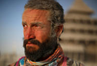 <p>Danicorn Hlavinka cries at the Temple Project as approximately 70,000 people from all over the world gather for the 30th annual Burning Man arts and music festival in the Black Rock Desert of Nevada, Aug. 30, 2016. (REUTERS/Jim Urquhart)</p>