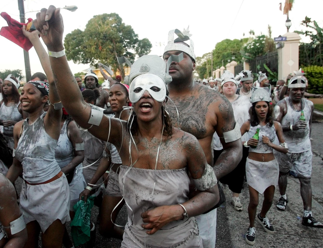 Revelers parade during a 'J Overt' (The Beginning) parade as part of Carnival festivities in Port of Spain, Trinidad and Tobago, February 7, 2005. REUTERS/Jorge Silva  JS/HB
