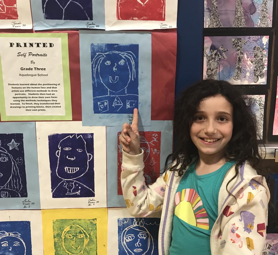 Payton Scudder at an art show; her parents are fighting to save electives. / Courtesy Scudder family.