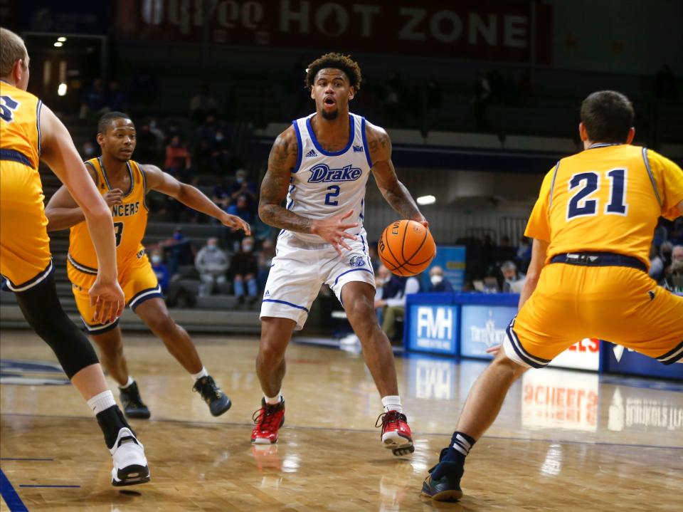 Drake forward Tremell Murphy moves inside against a trio of Mount Marty defenders in the first half of an NCAA men's basketball game on Tuesday, Dec. 28, 2021, at the Knapp Center at Drake University in Des Moines, Iowa.