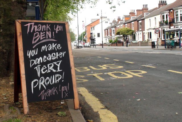 A sandwich board in Doncaster with a tribute message to Lance Bombardier Ben Parkinson, 27, the most seriously wounded soldier to survive the war in Afghanistan, who carried the Olympic Flame through his home town of Doncaster