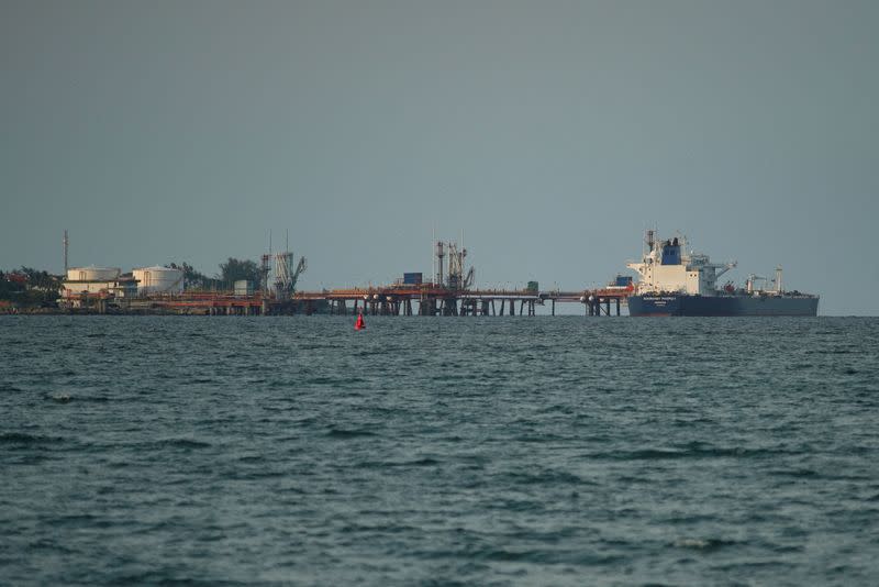 FILE PHOTO: Tanker carrying barrels of Russian fuel oil delivers its cargo in Matanzas